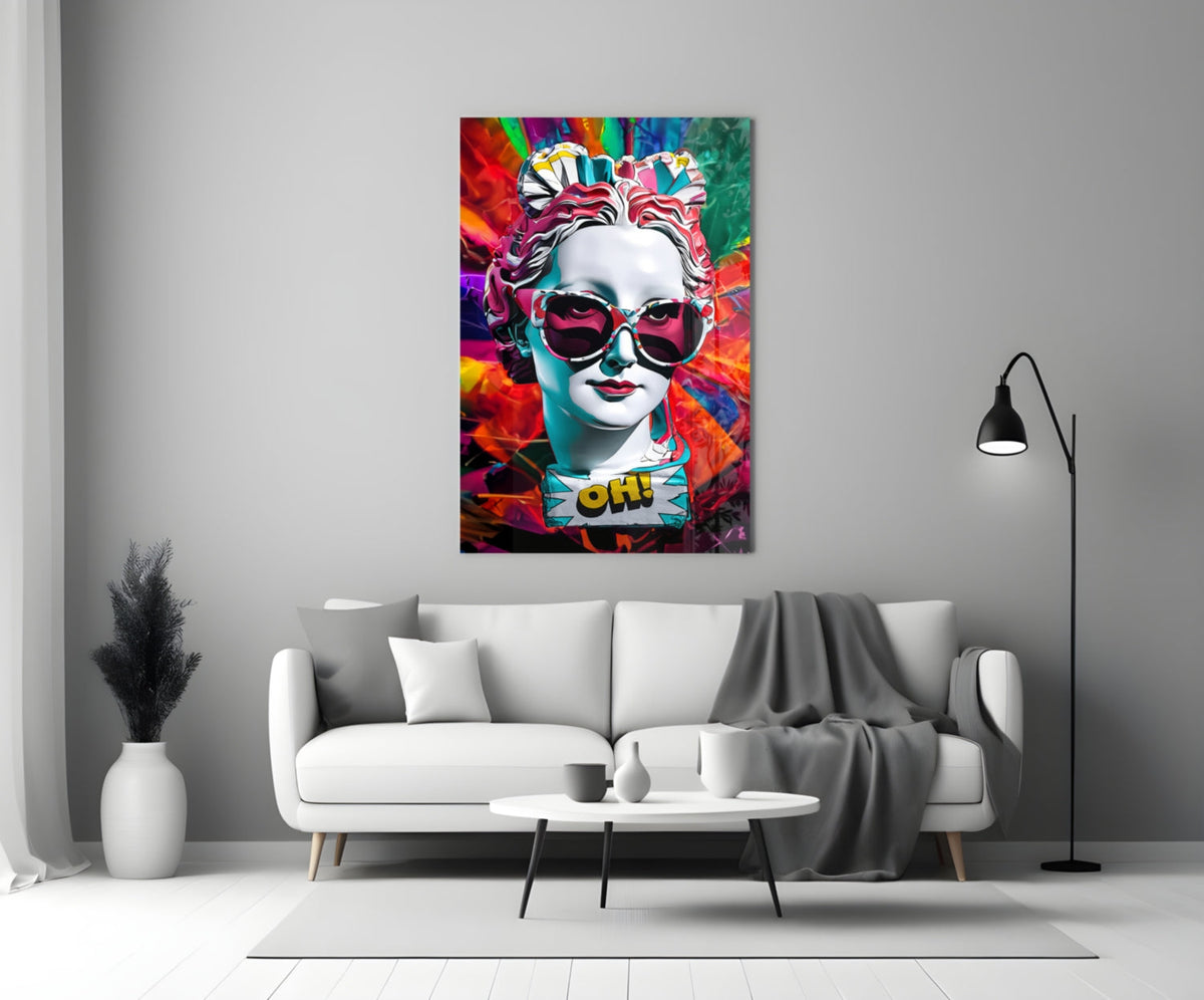 White bust in sunglasses glass wall art above a white sofa and coffee table beside a floor lamp
