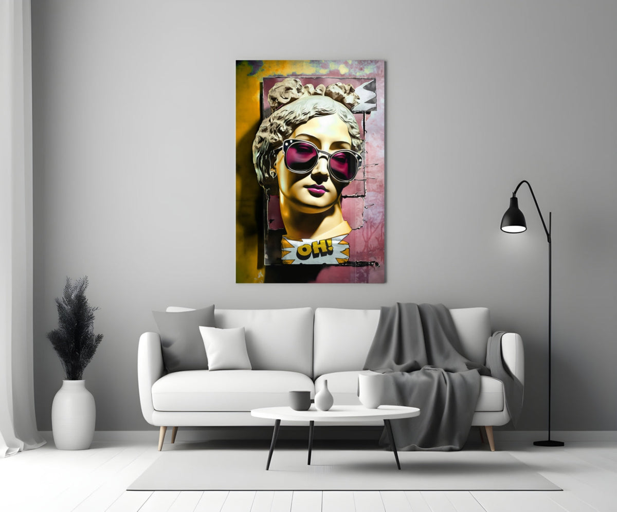Gold bust in sunglasses on torn pink wall glass wall art above a white sofa and coffee table beside a black floor lamp