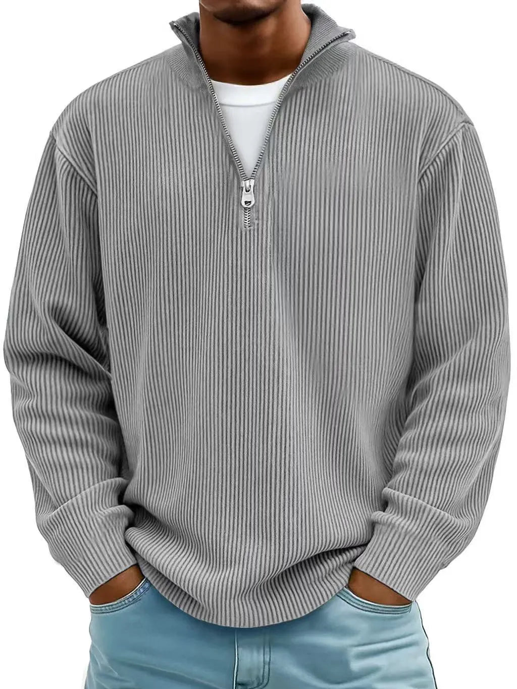 Man wearing a gray ribbed sweater with a zipper on a white background