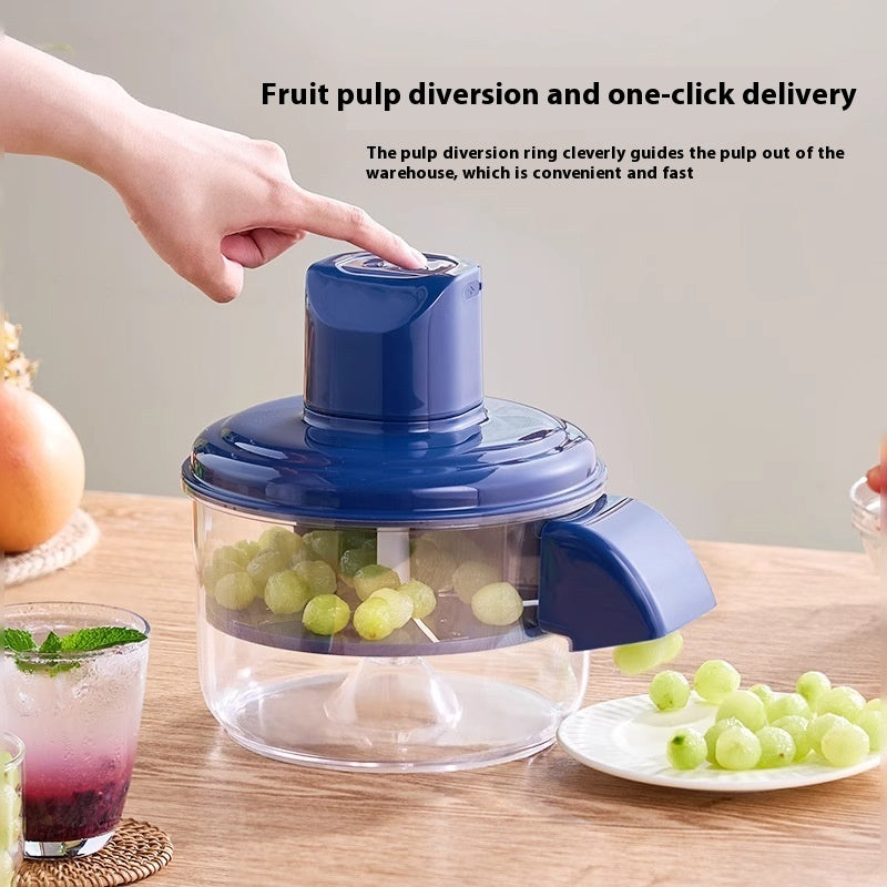 Fruit pulping device with grapes on a wooden table
