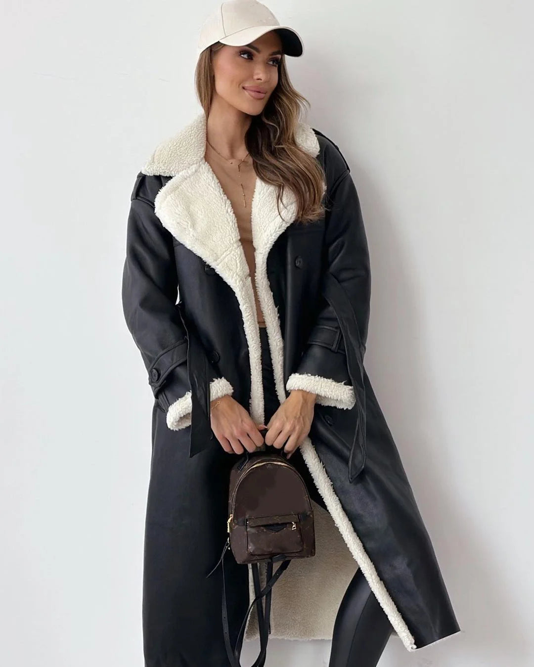 front view of black faux shearling lined winter coat
