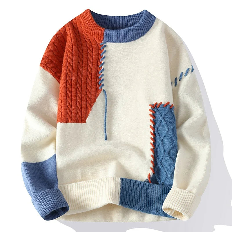 front view of orange and blue patch cable knit sweater

