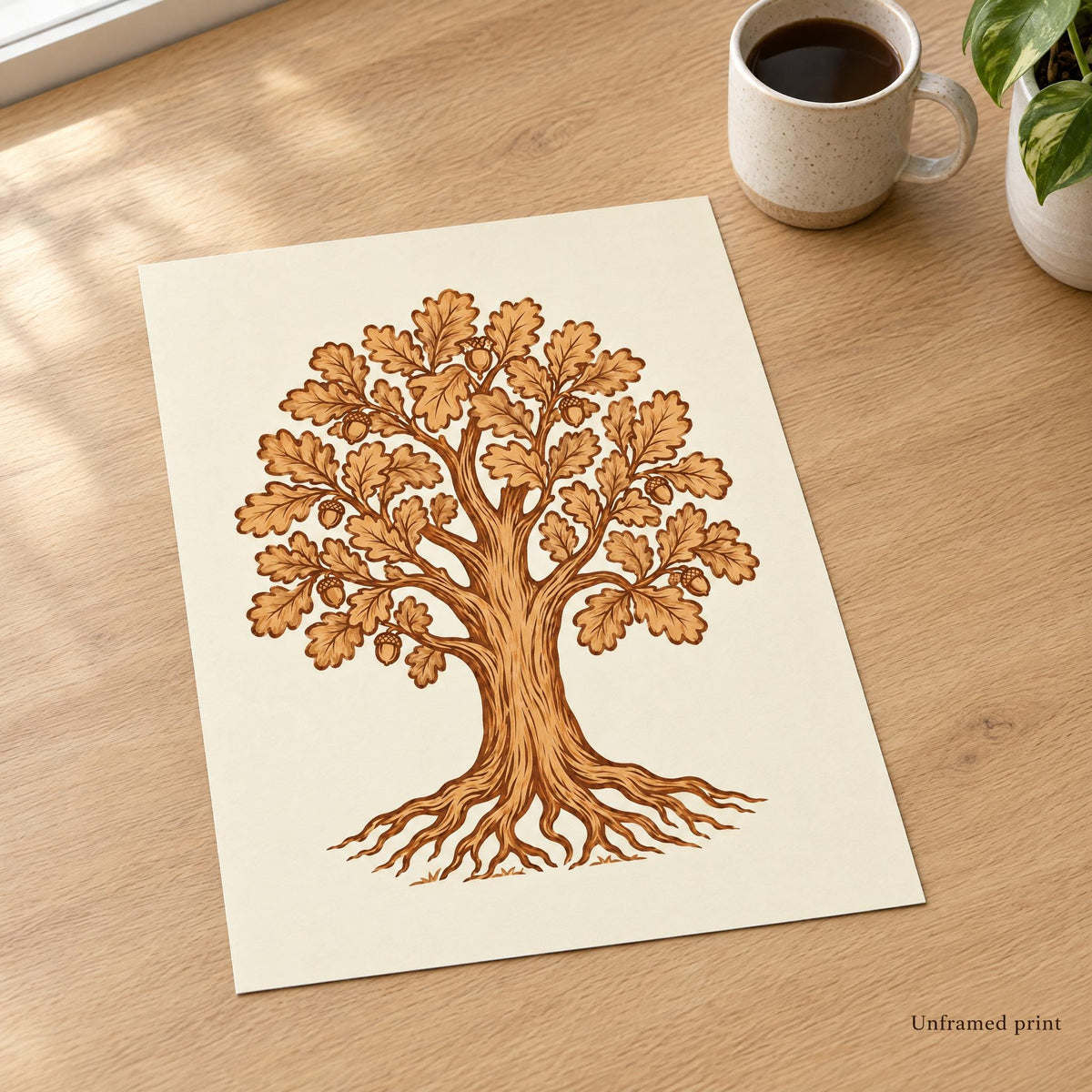 Unframed oak tree art print in leather tones lying flat on an oak desk, shown without a frame