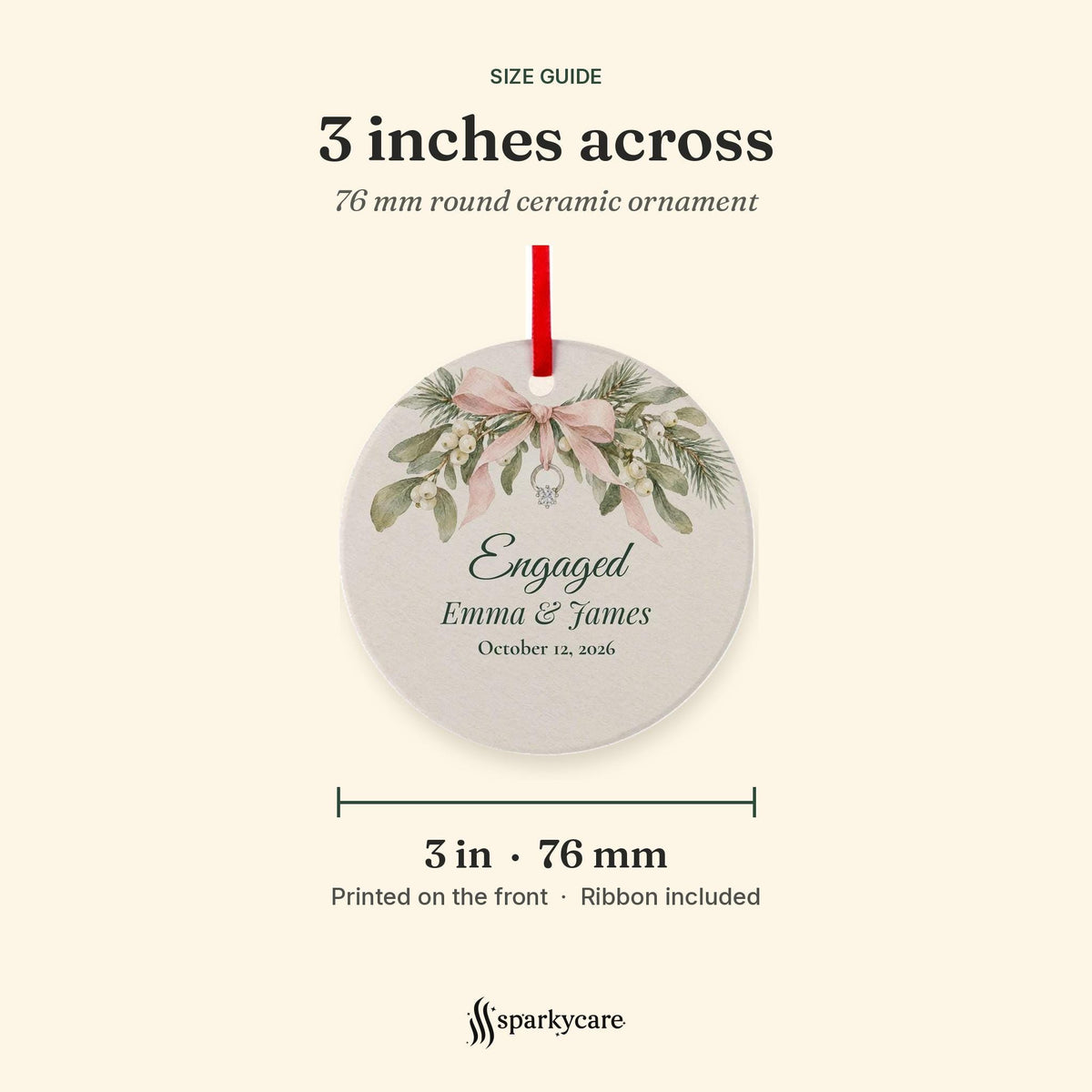 Size guide: the round ceramic engagement ornament is 3 inches, 76 mm, across, printed on the front, ribbon included