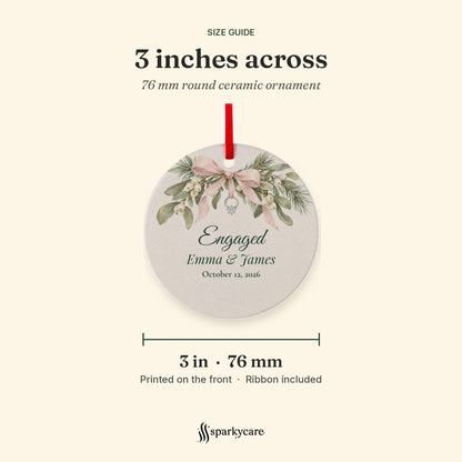 Size guide: the round ceramic engagement ornament is 3 inches, 76 mm, across, printed on the front, ribbon included