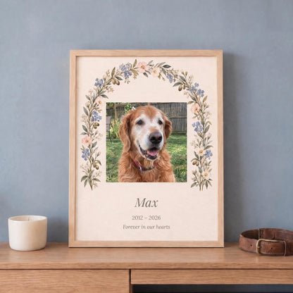 Pet memorial gift: custom dog photo print with name and years in a light wood frame, leaning on a dresser by a collar
