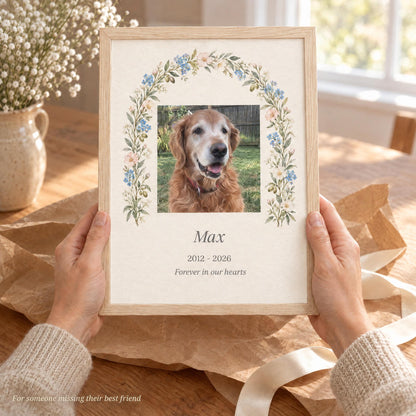 Hands holding a framed dog memorial gift with name and years over kraft paper, a gentle pet sympathy gift