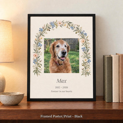 Dog memorial frame in black with the dog's photo and name, standing on a walnut bookshelf beside books