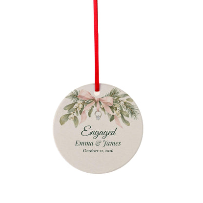 Ceramic ornament preview of the Engagement Ornament on a plain background