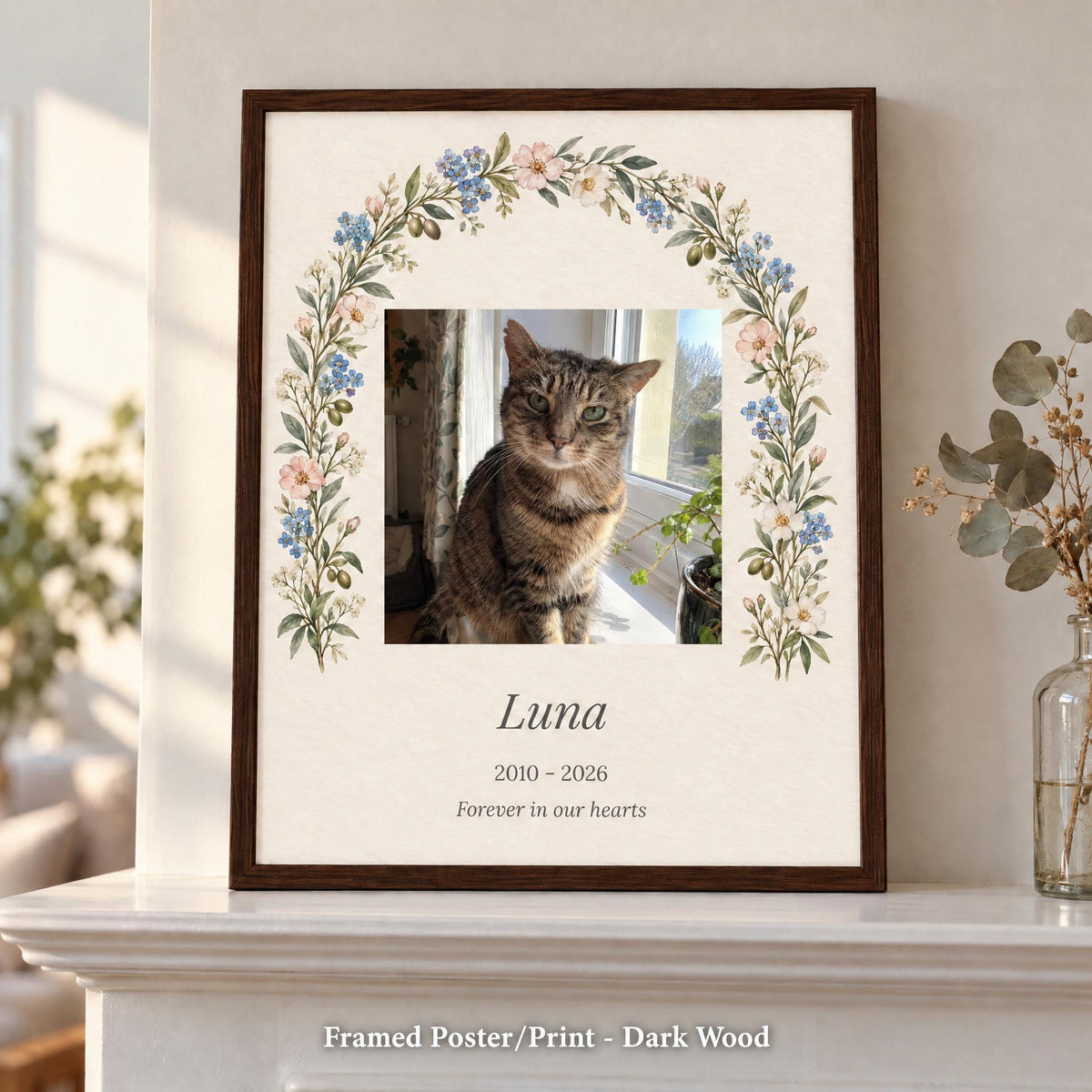 Pet loss gift in a dark wood frame with a cat photo, name and years, standing on a white mantel