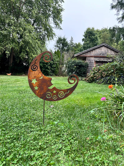 Crescent moon metal wall art with a rust finish, handcrafted for indoor or outdoor