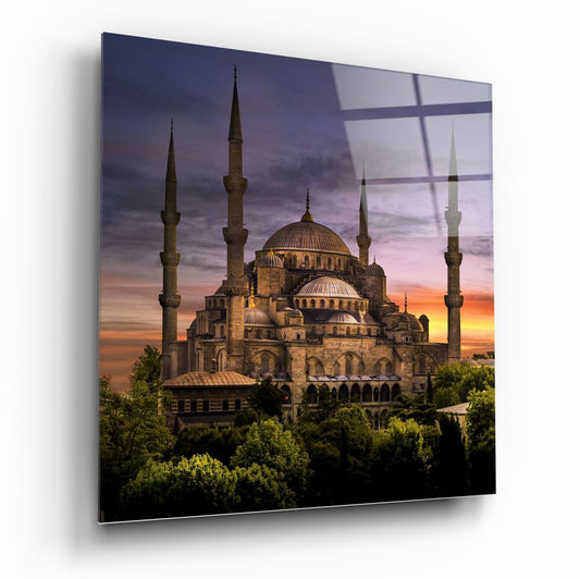 Mosque and gardens at dusk glass wall art, domes and minarets over leafy trees under a violet sky, square format