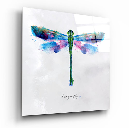 Green dragonfly with blue and pink watercolor wings on a soft white background, square glass piece on white