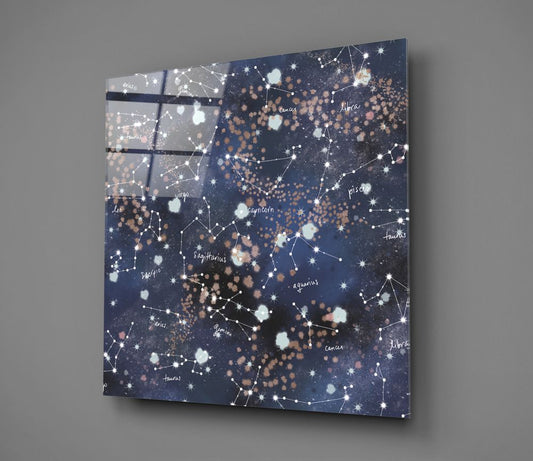 Zodiac constellations glass wall art shown at an angle on a gray background