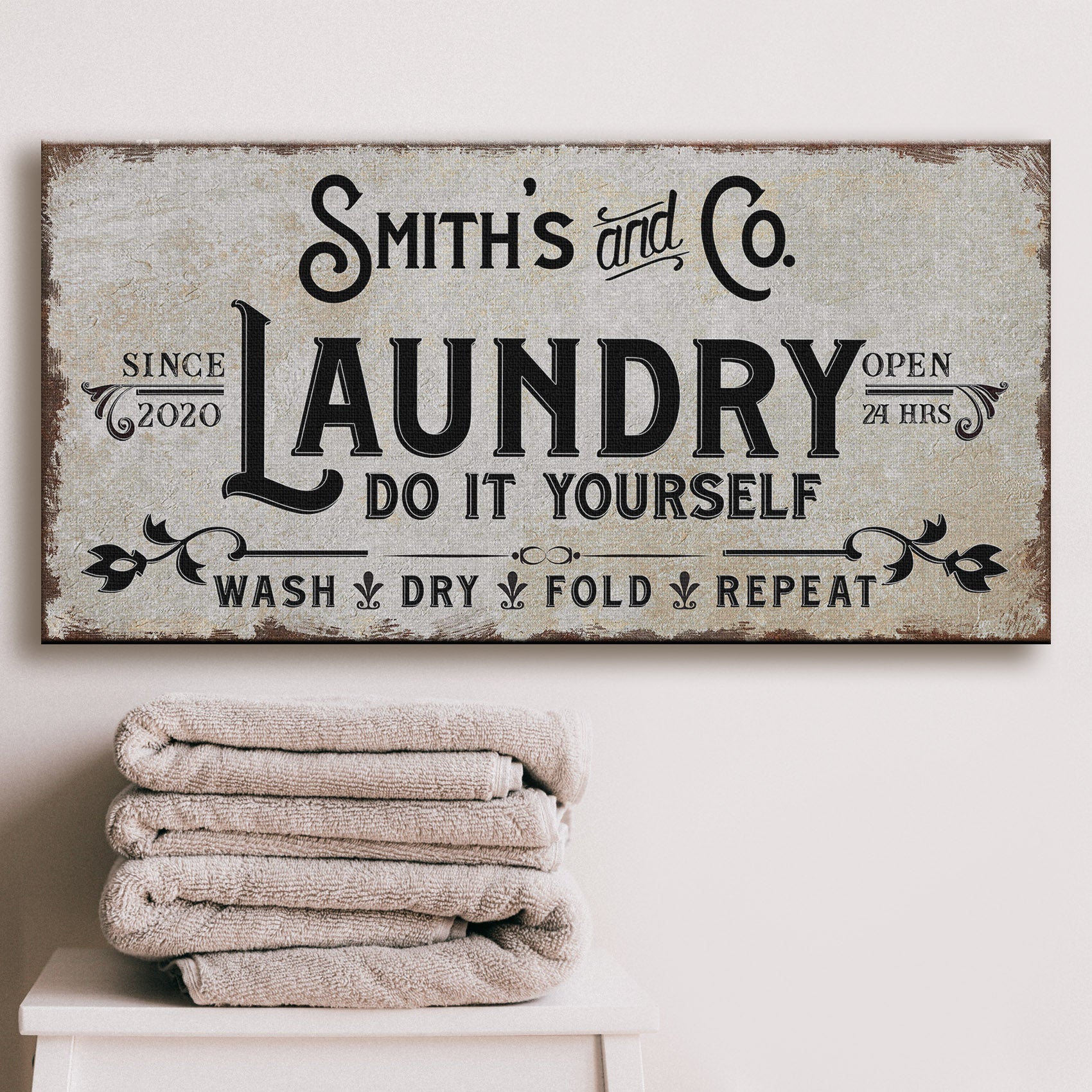Personalized laundry room canvas sign with rustic wood-tone lettering and custom family name