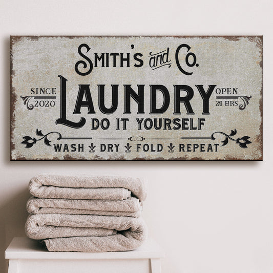 Personalized laundry room canvas sign with rustic wood-tone lettering and custom family name