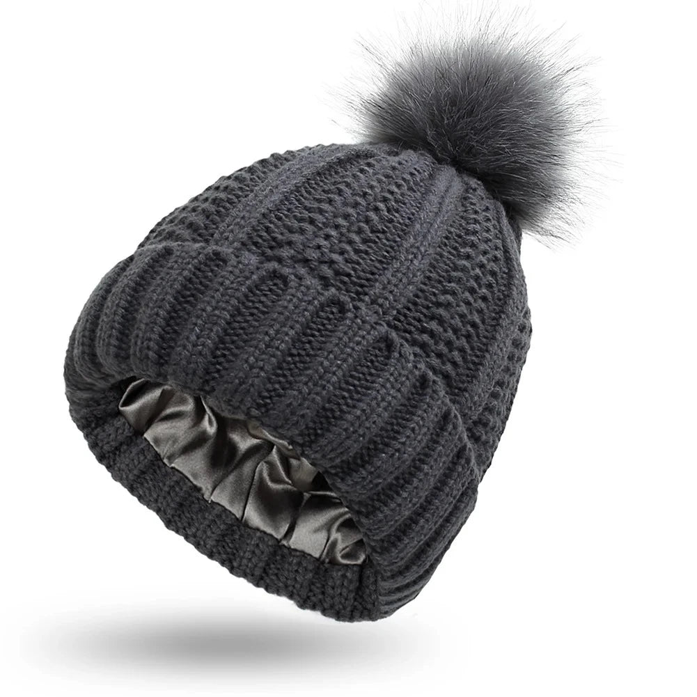 Dark Grey cable knit beanie with silk satin interior lining protects hair from frizz