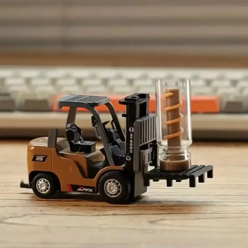 Toy forklift with a glass container on a wooden surface