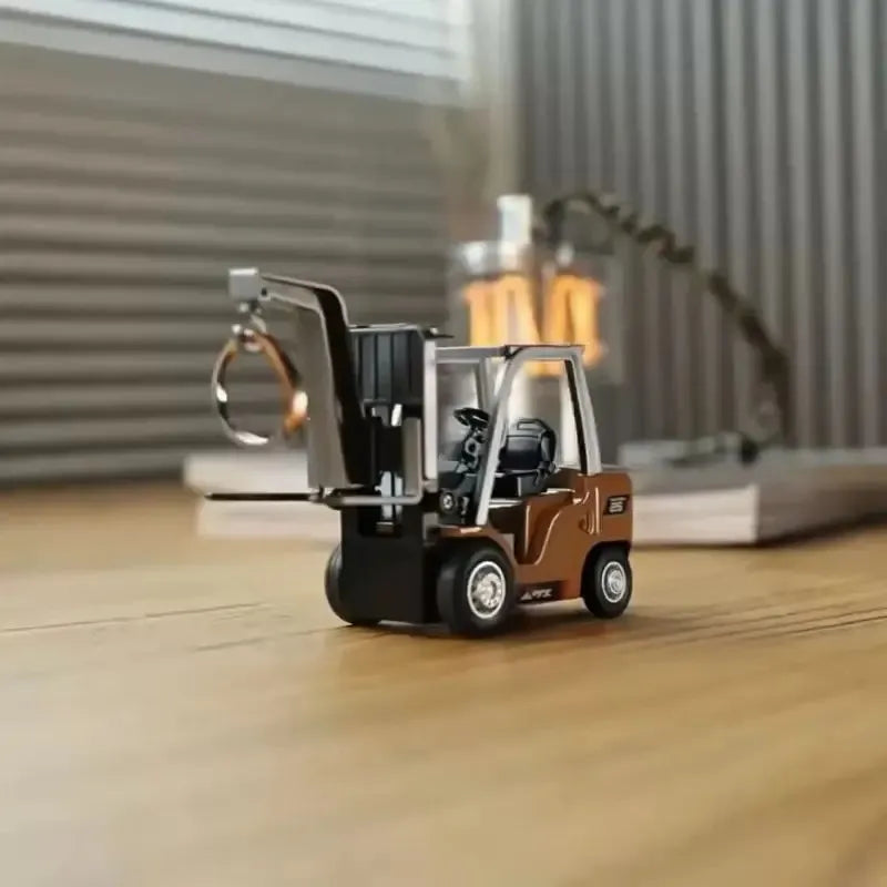 Small model of a forklift on a wooden surface with a blurred background