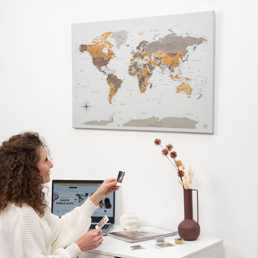 Desert-toned world map canvas wall art in a pine wood frame