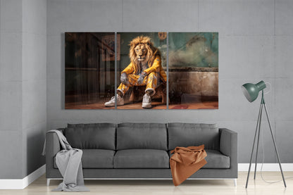 Lion in a yellow puffer jacket 3-panel glass wall art set above a gray sofa beside a floor lamp