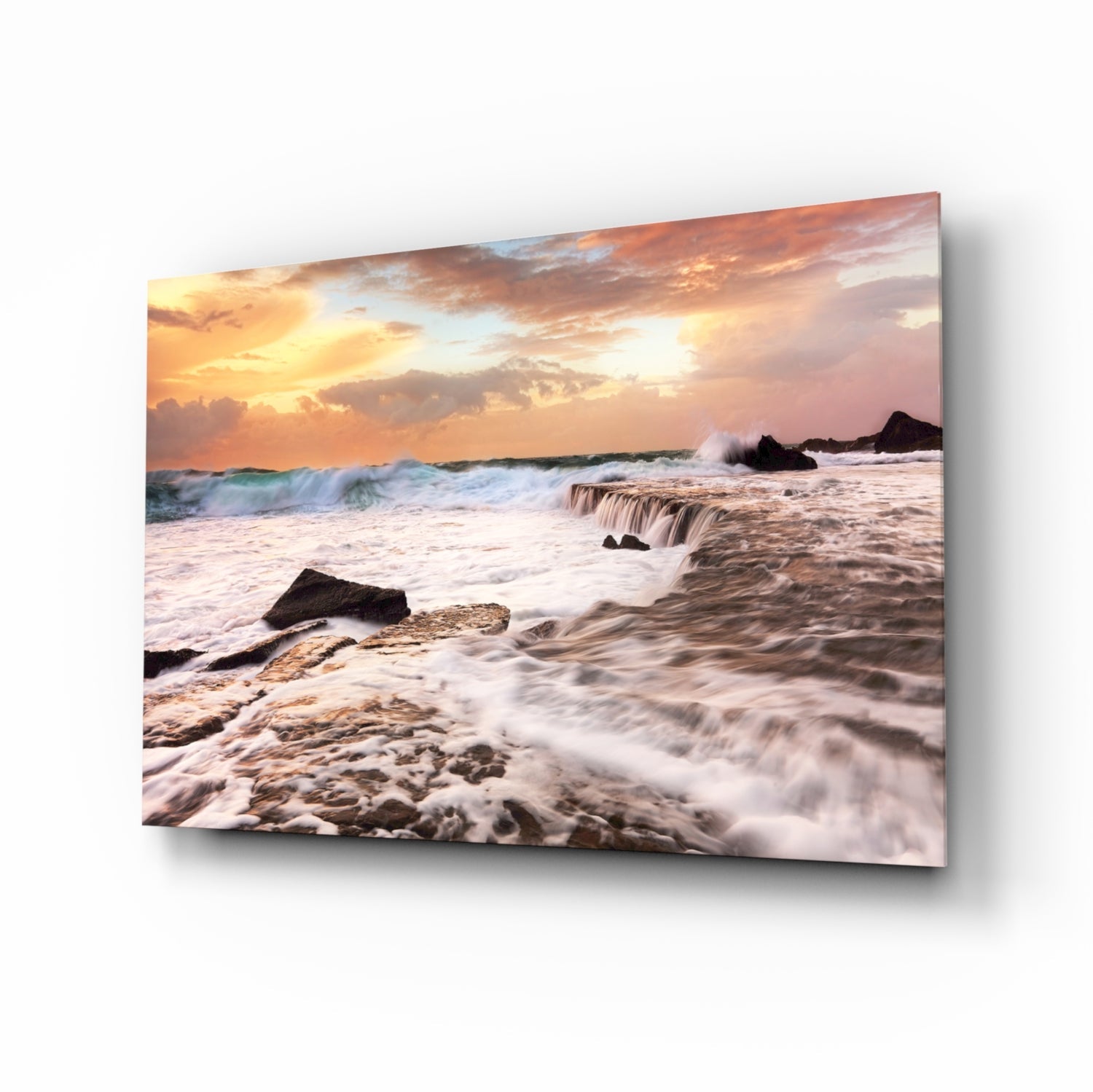Vicious waves glass wall art, white surf crashing over coastal rocks at peach-coral golden hour