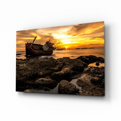 Shipwreck coastal glass wall art at golden hour