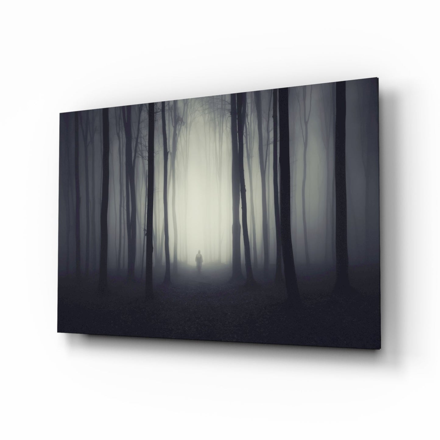 Lone figure in dark misty woods glass wall art