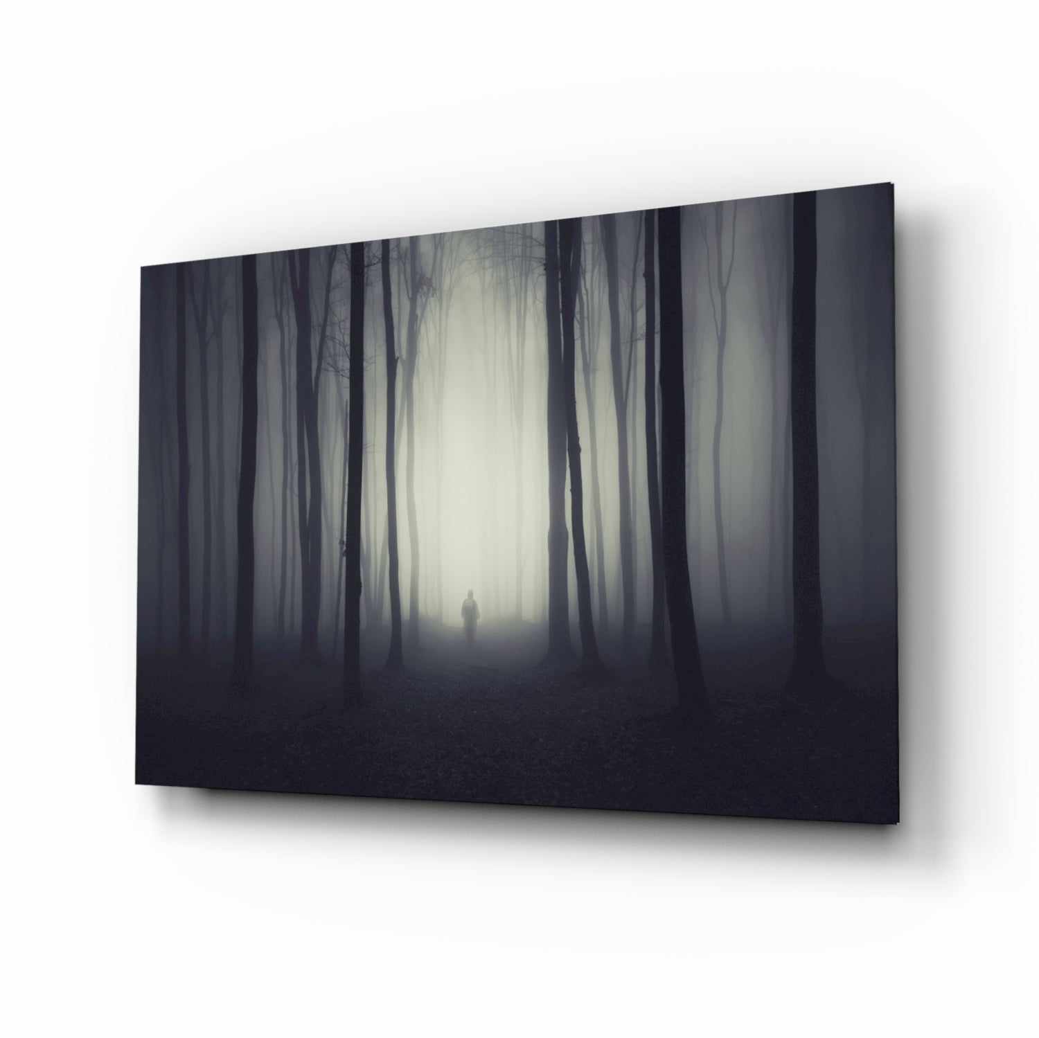 Lone figure in dark misty woods glass wall art