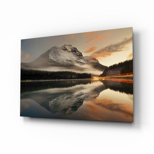 Alpine lake and snow-capped mountain glass wall art at golden-hour sunrise
