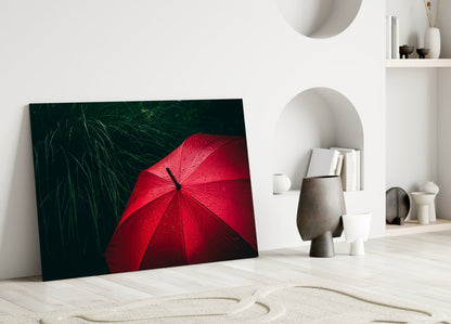 Red Umbrella in Dark Green Grass Glass Wall Art
