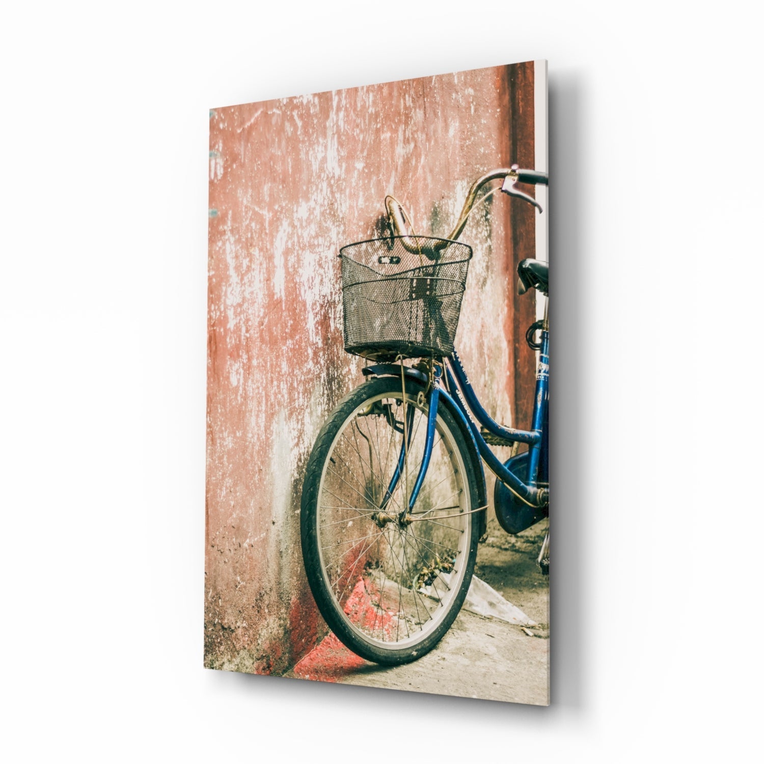 Cobalt vintage bicycle with basket against terracotta wall, travel glass wall art on tempered glass