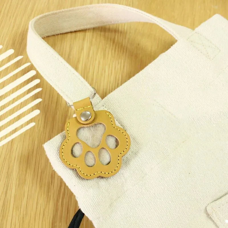 paw shaped remembrance keyring attached to tote bag