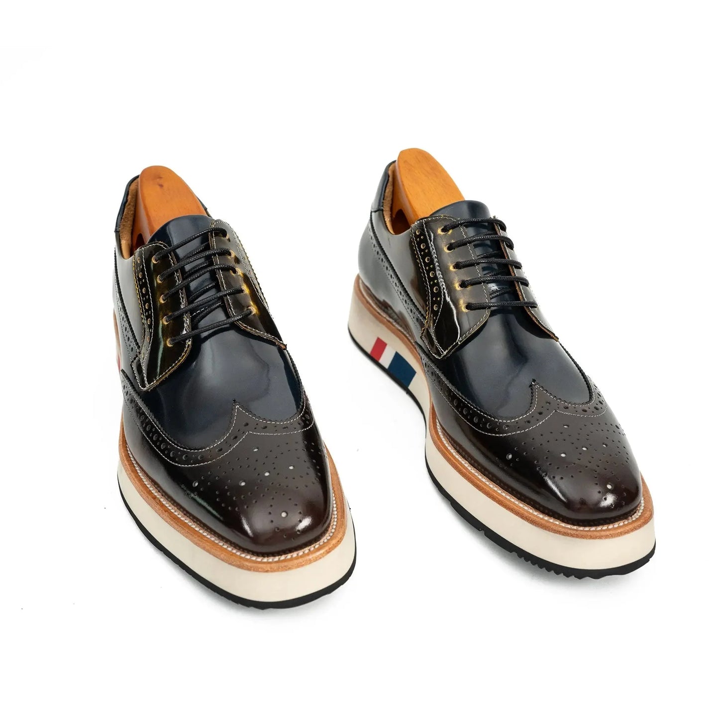 platform brogue shoes pair display showing wingtip perforations and striped sole detail