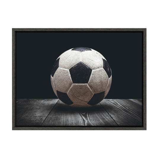 Vintage soccer ball framed canvas wall art in a gray frame, ready to hang