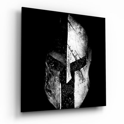 Black and white Spartan helmet square glass wall art shown at an angle on a white background