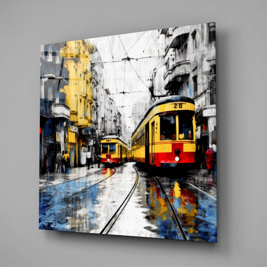 Two yellow trams on wet tracks square glass wall art on a plain gray wall
