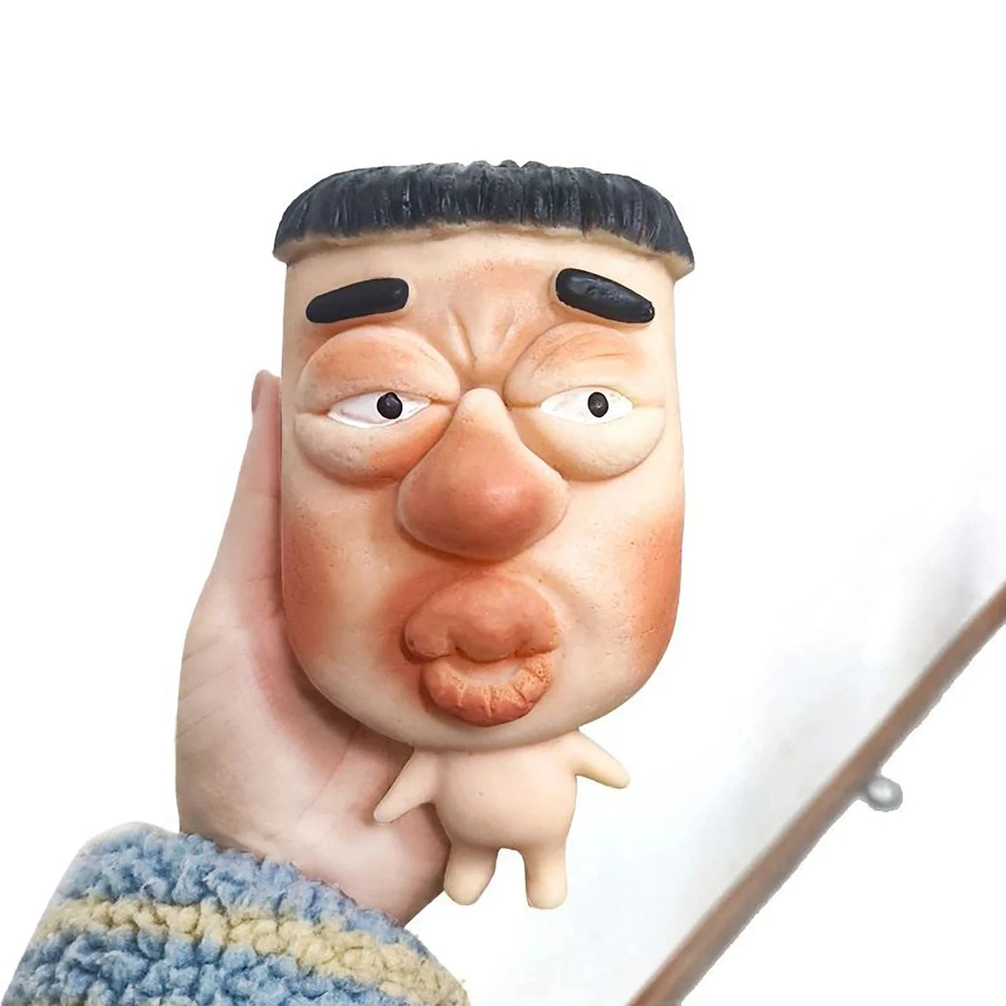 squeeze face toy size reference in hand