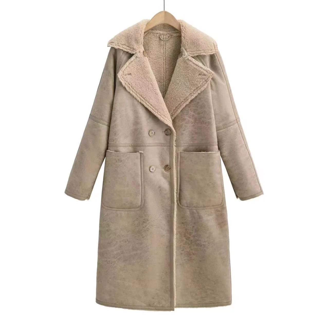 tan faux shearling coat styled with beige outfit
