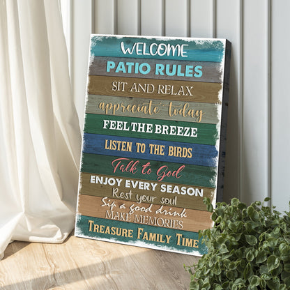 Patio Rules Teal Plank canvas sign leaning against white wall paneling beside a curtain and a green plant