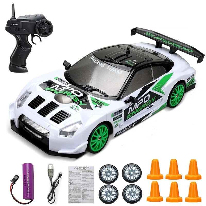 white green track style rc drift car with 24ghz remote control and spare tire set