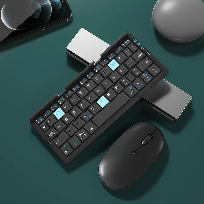 wireless travel keyboard and mouse set on green desk