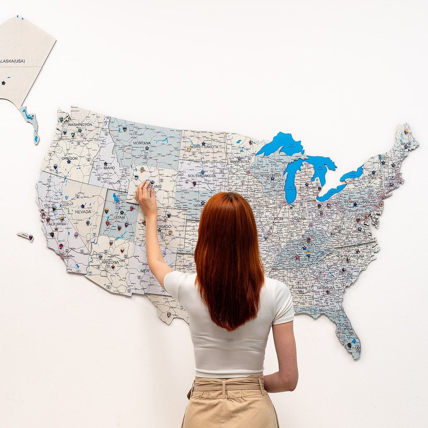 Wooden USA map wall art with Alaska panel on a wall