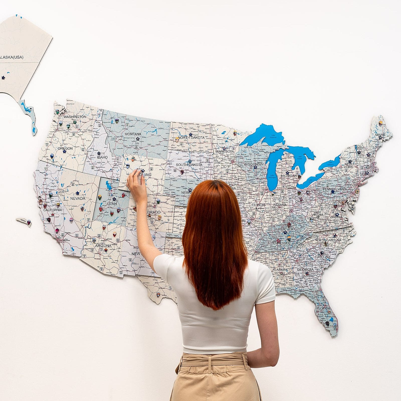 Wooden USA map wall art with Alaska panel on a wall