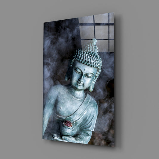 Jade Buddha statue glass wall art on a gray wall, angled to show the glossy front