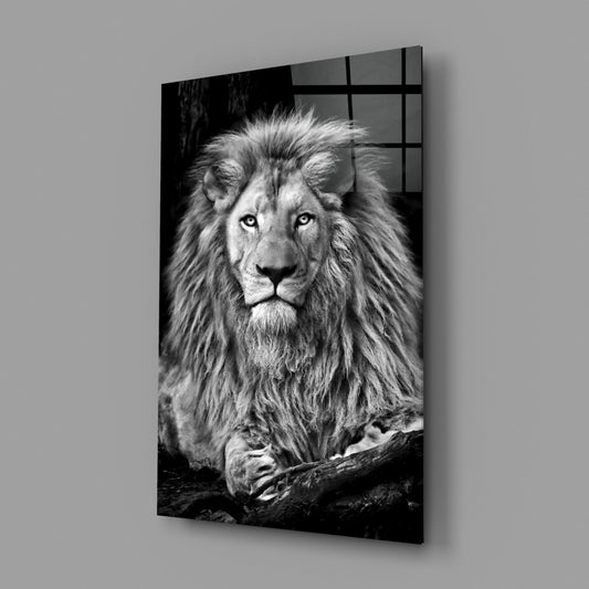 Black and white lion glass wall art angled against a plain gray backdrop