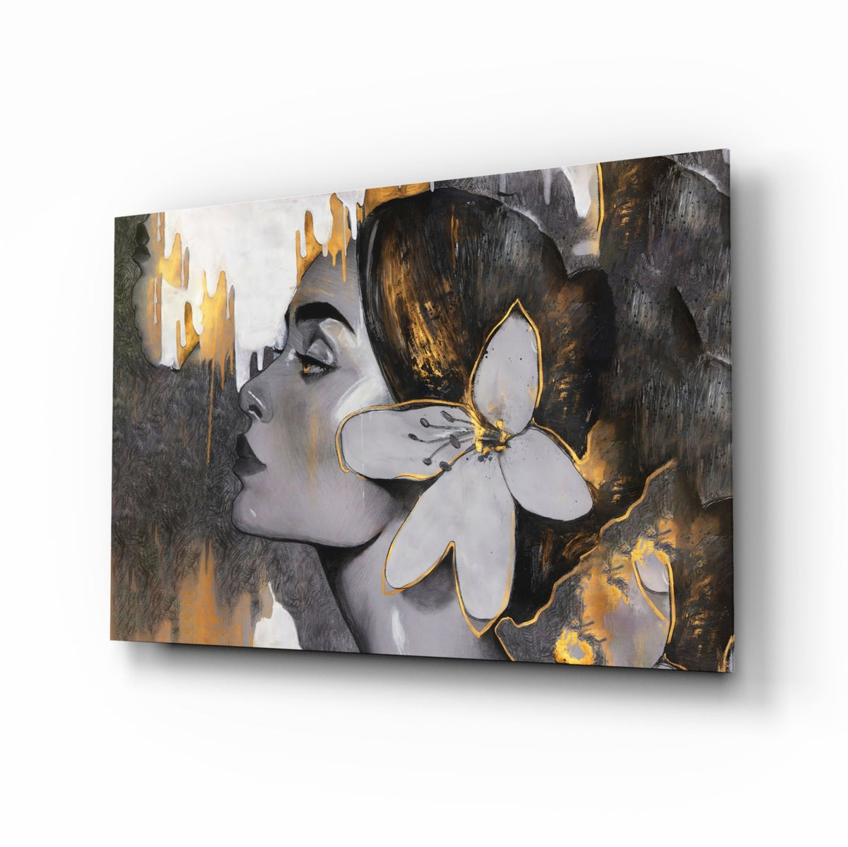 Woman with a white lily in gold and gray glass wall art angled on a white background