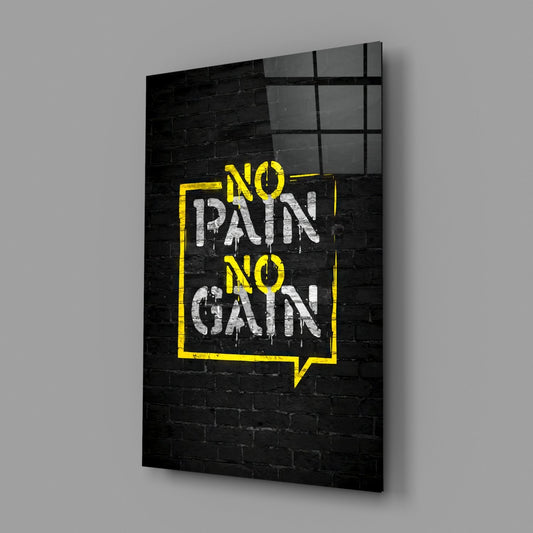 No pain no gain yellow graffiti glass wall art on a gray wall with a soft window reflection