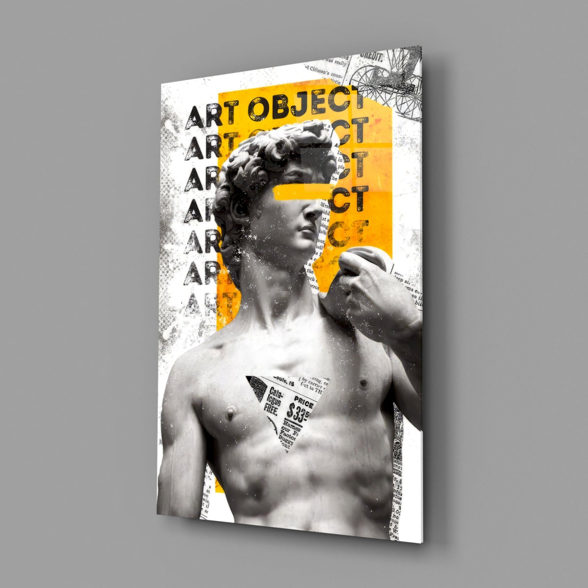 Marble statue on yellow newsprint collage glass wall art angled against a soft gray backdrop