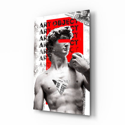 Marble statue on red newsprint collage glass wall art shown at an angle on a white background